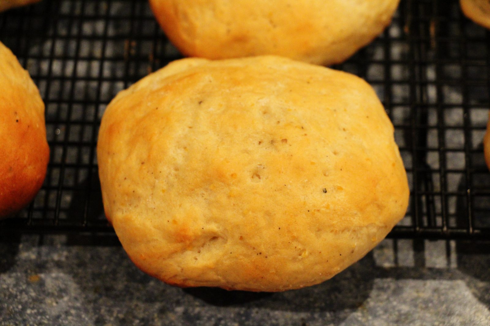 Golden loaves cooling on a wire rack